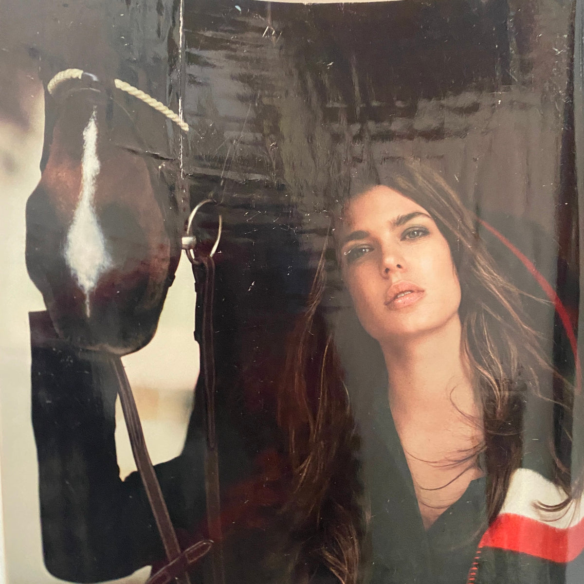 Close-up of a model featured in Gucci Forever Now magazine, displaying high-fashion attire with an equestrian influence.