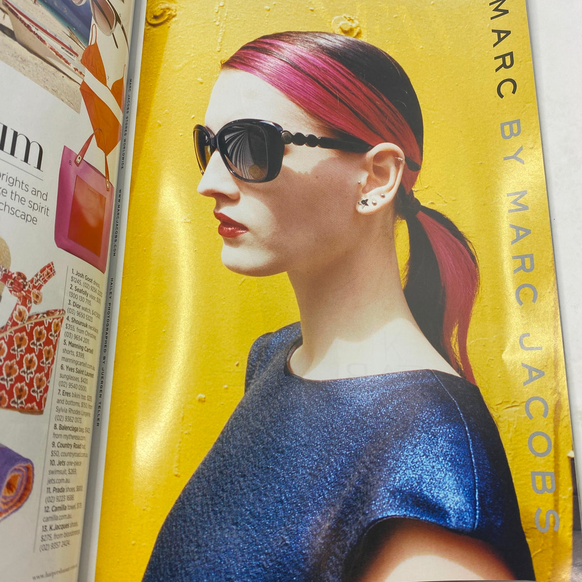 Harper's Bazaar Australia Magazine December 2012 showcasing a model with sleek pink hair and black sunglasses against a vibrant yellow background, highlighting Marc by Marc Jacobs.