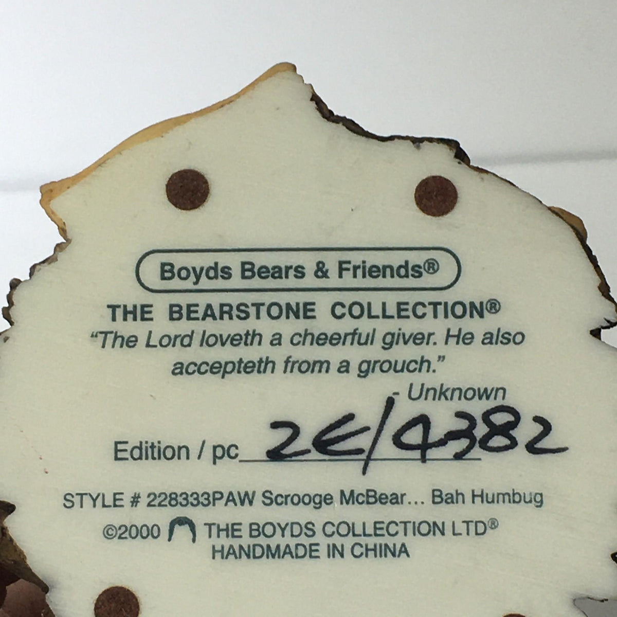 Bottom view of the Bearstone Collection style #228333 PAW Scrooge McBear figurine showcasing the labeling and edition information, emphasizing its collectible status. Bah Humbug!