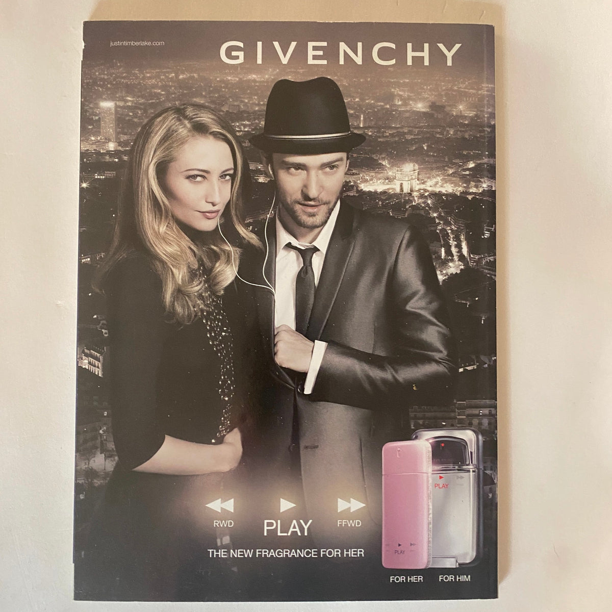 Promotional cover for Givenchy fragrance from Harper's Bazaar Australia Magazine June 2011, featuring elegantly dressed models in an urban night setting.