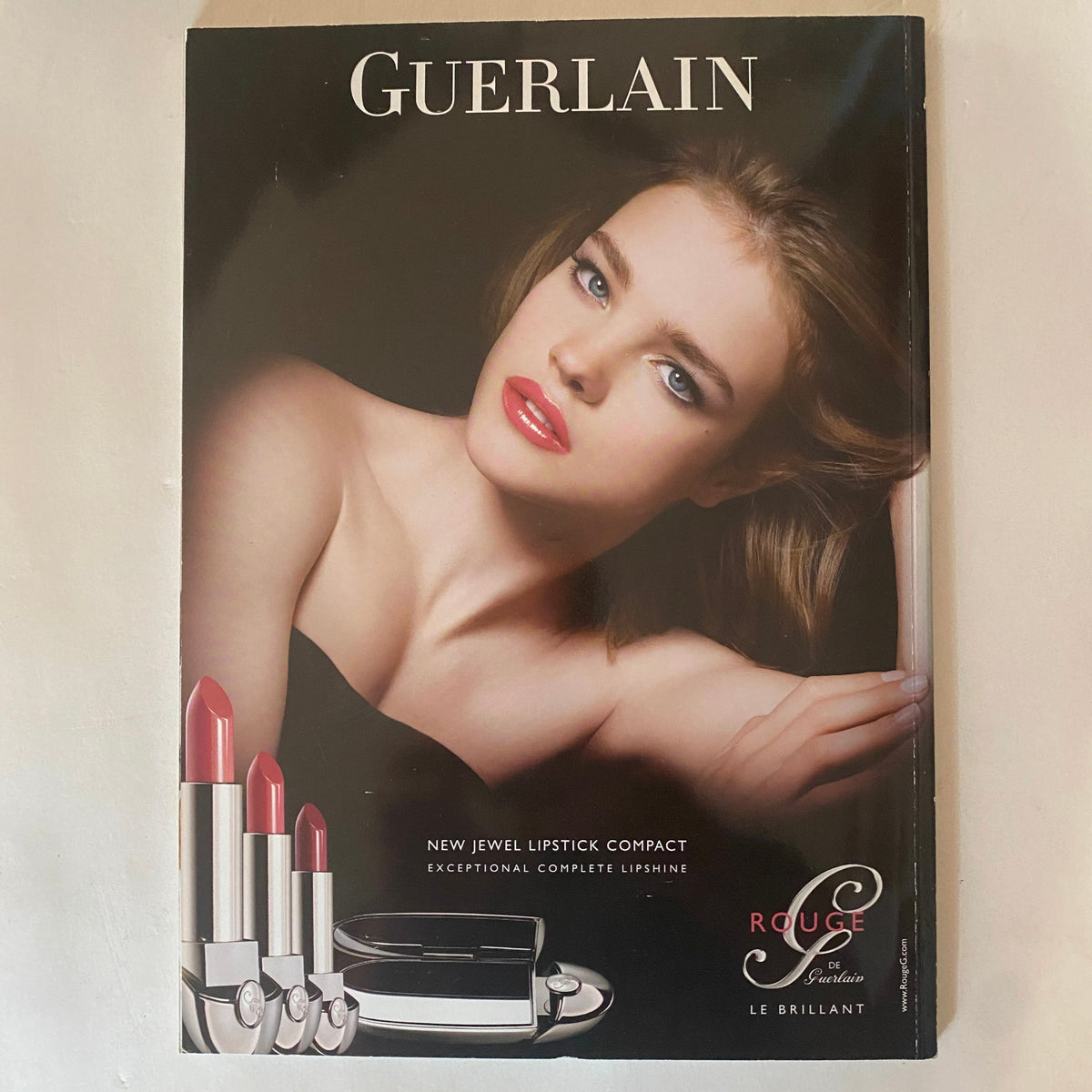 Harper's Bazaar Australia Magazine June July 2010 showcasing the face of a model with bold makeup, emphasizing the luxurious Guerlain lipsticks, presenting a glamorous beauty aesthetic.