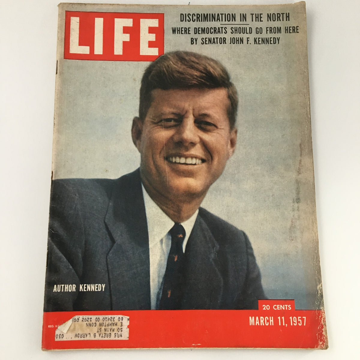 Vintage March 11, 1957 Life Magazine featuring Senator John F. Kennedy on the cover, highlighted by the title 'Discrimination in the North'. An iconic publication reflecting historical significance.