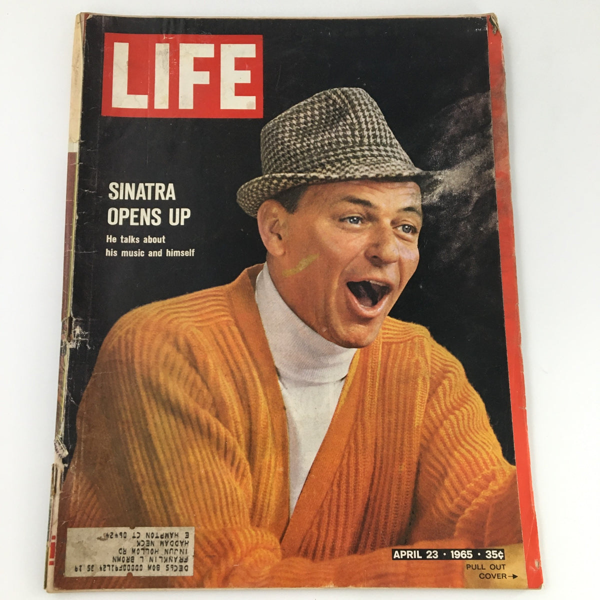 VTG Life Magazine April 23 1965 featuring Frank Sinatra on the cover smiling and wearing a knitted hat and orange cardigan. The magazine includes an exclusive interview where Sinatra discusses his music and personal life.
