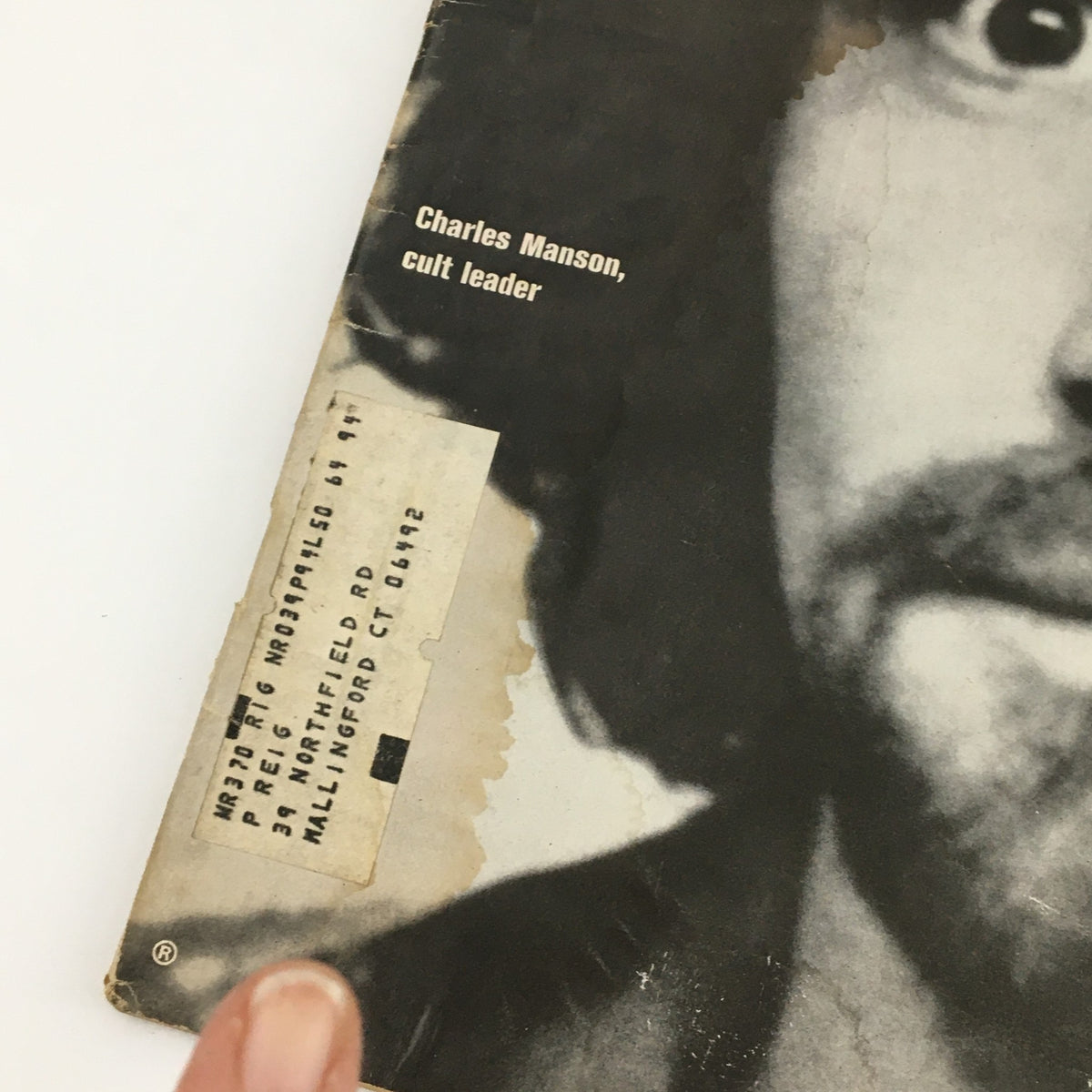 Detailed look at the corner of the VTG Life Magazine December 19, 1969 cover showing Charles Manson, featuring an address label and imperfections.