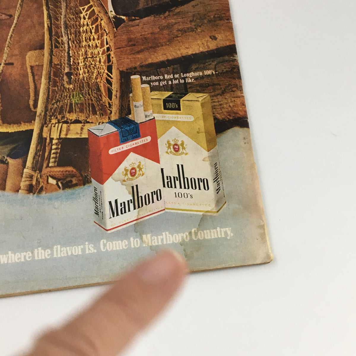 Detail of the VTG Life Magazine December 19, 1969 cover featuring an advertisement for Marlboro cigarettes, showcasing Marlboro Red and Longhorn 100's. This vintage magazine captures a glimpse of advertising style from the late 1960s.