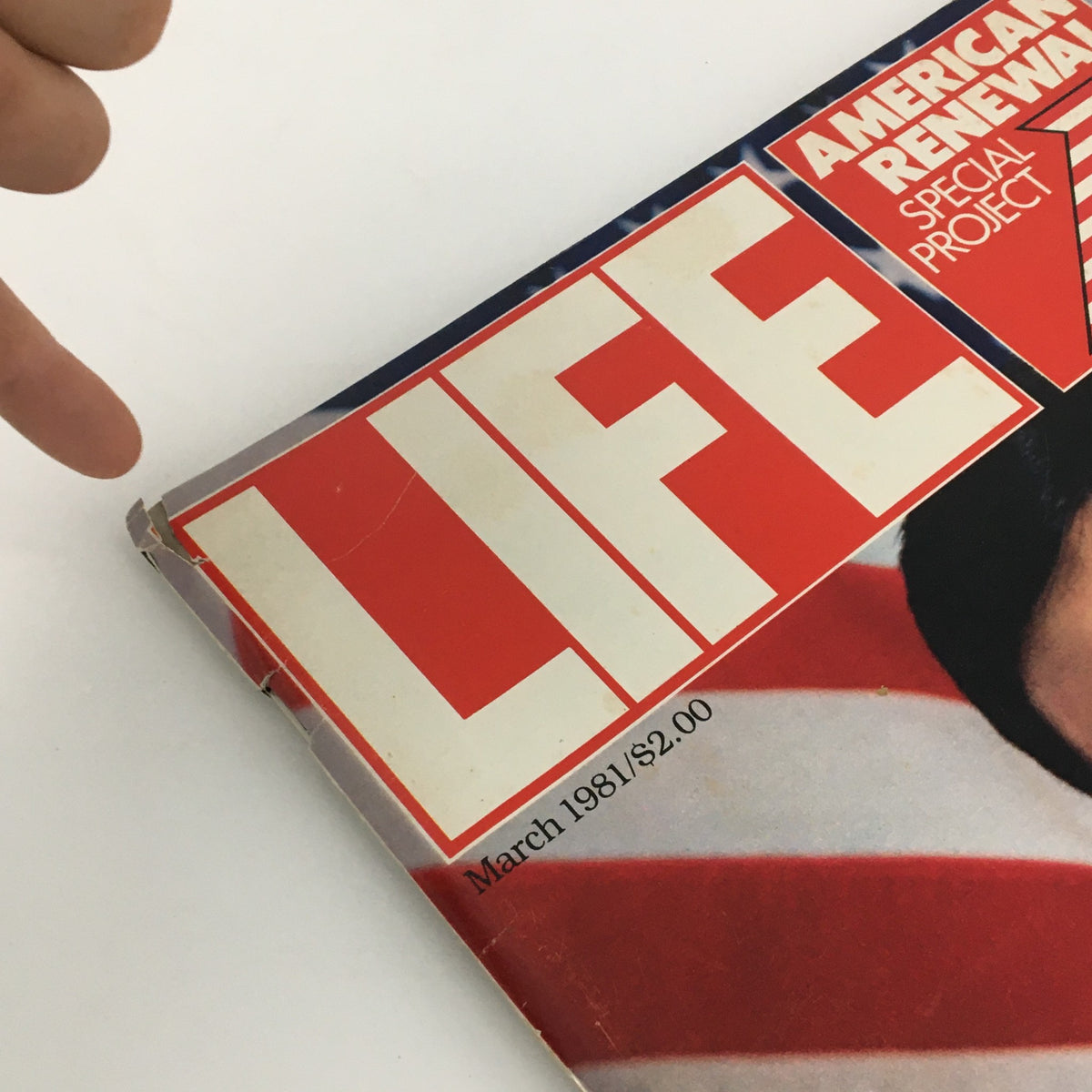 Close-up view of the cover of VTG Life Magazine March 1981 featuring former hostage Jimmy Lopez, showcasing the iconic bold 'LIFE' title and the mention of the issue date. This image highlights minor wear on the magazine's edges, indicative of its vintage authenticity.