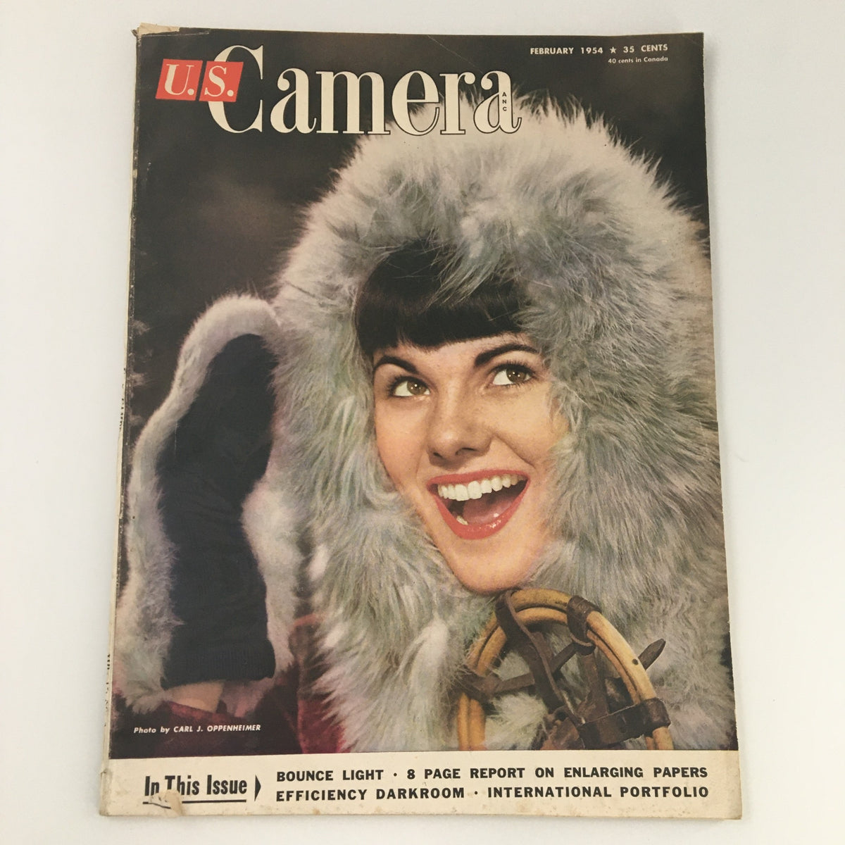 VTG U.S. Camera Magazine February 1954 Cover Photo by Carl Oppenheimer featuring a smiling model in a fur-lined hood, showcasing vintage photography themes and artistic expression of the mid-20th century.