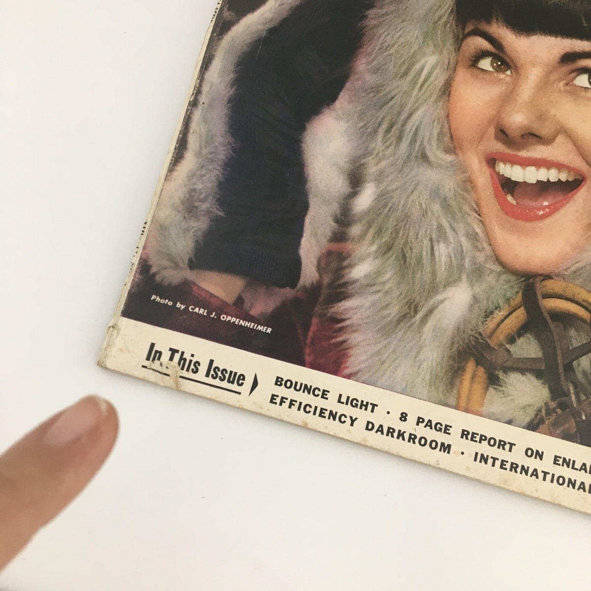 Cover of VTG U.S. Camera Magazine February 1954 featuring a vintage photo by Carl Oppenheimer, showcasing a smiling woman in fur-lined attire, highlighting photography trends of the era.