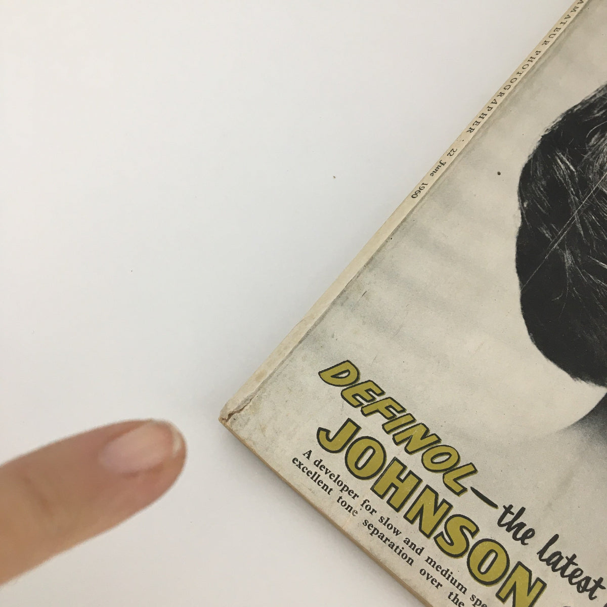 Close-up of the binding edge of the VTG Amateur Photographer Magazine June 22, 1960, showcasing minor wear and the magazine title along with Johnson Chemicals advertisement.