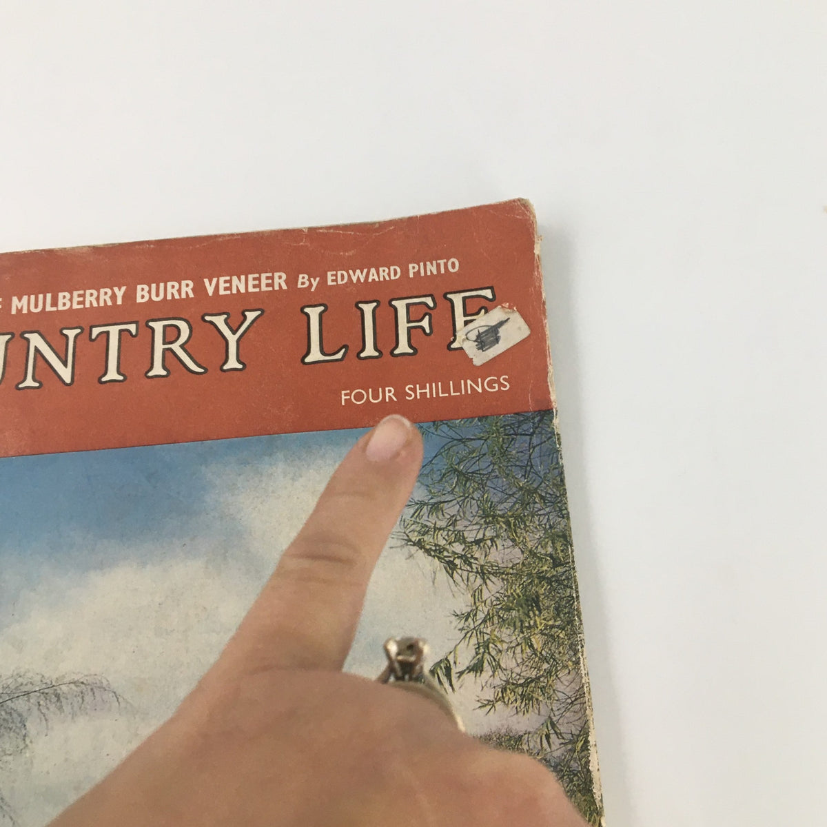 Detail shot of the VTG Country Life Magazine October 2, 1969 cover, pointing to the "Four Shillings" price label and magazine title.