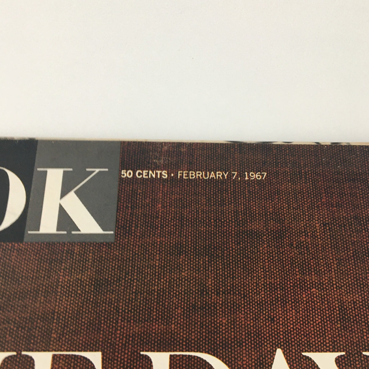 Close-up view of the Look Magazine cover date and price, highlighting '50 cents . February 7, 1967' along with the magazine title 'Look' and key content related to JFK.