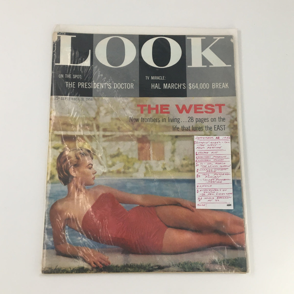 VTG Look Magazine September 18 1956 displayed in a protective sleeve, featuring a swimsuit model cover and showcasing articles about life in the West.