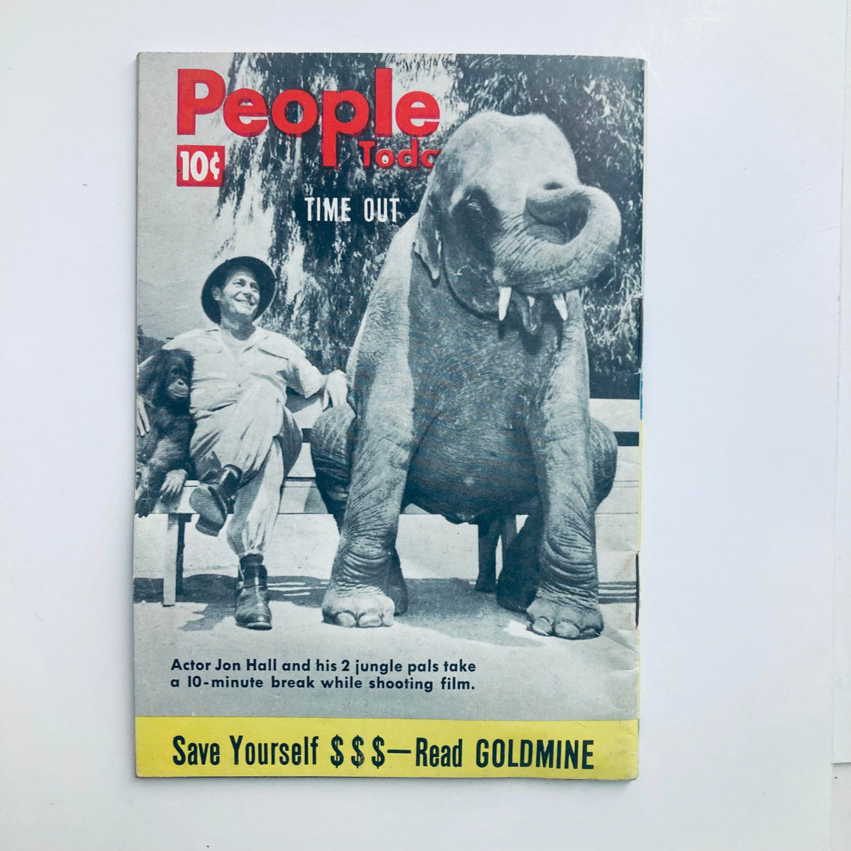 Back cover of VTG People Today Magazine October 6 1954 Vol 9 No. 7 showing actor Jon Hall with an elephant and an orangutan, emphasizing a playful moment during a film shoot.