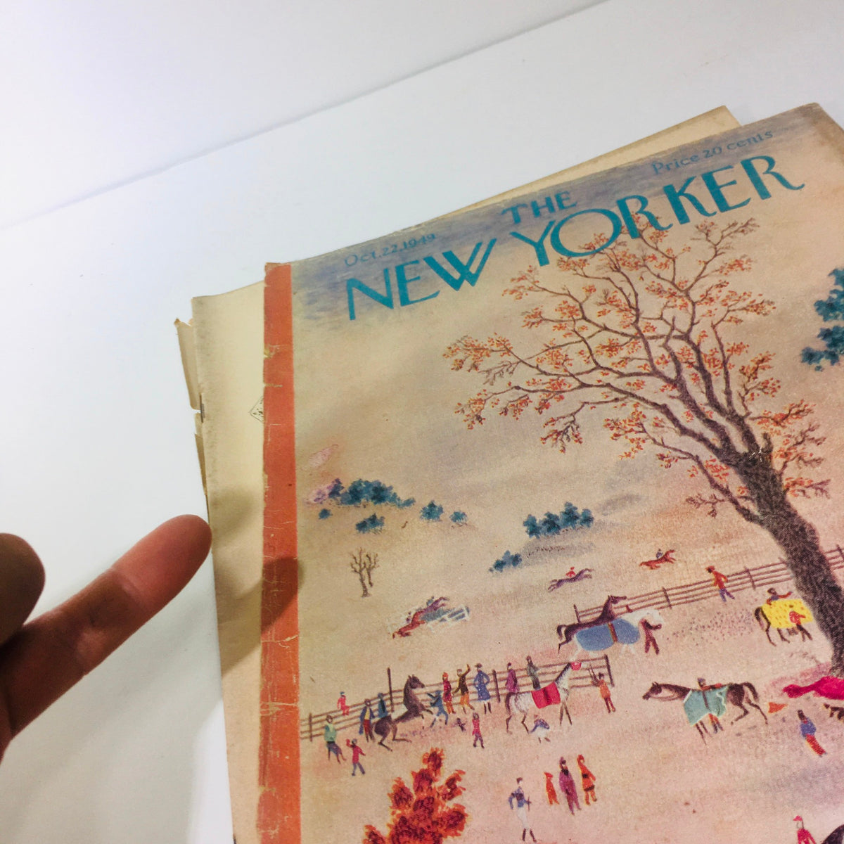 Close-up view of the October 22, 1949, issue of The New Yorker, showcasing the vintage artwork by Joseph Low and elements of wear, highlighting its historical significance.