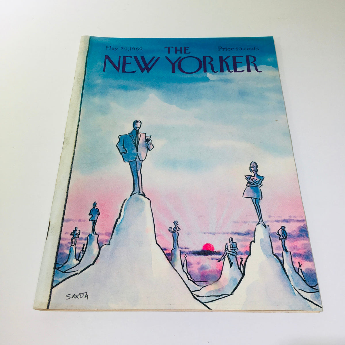 Cover of The New Yorker May 24, 1969 featuring a full magazine theme illustration by Charles Saxon, showcasing stylized figures against a pastel sky.