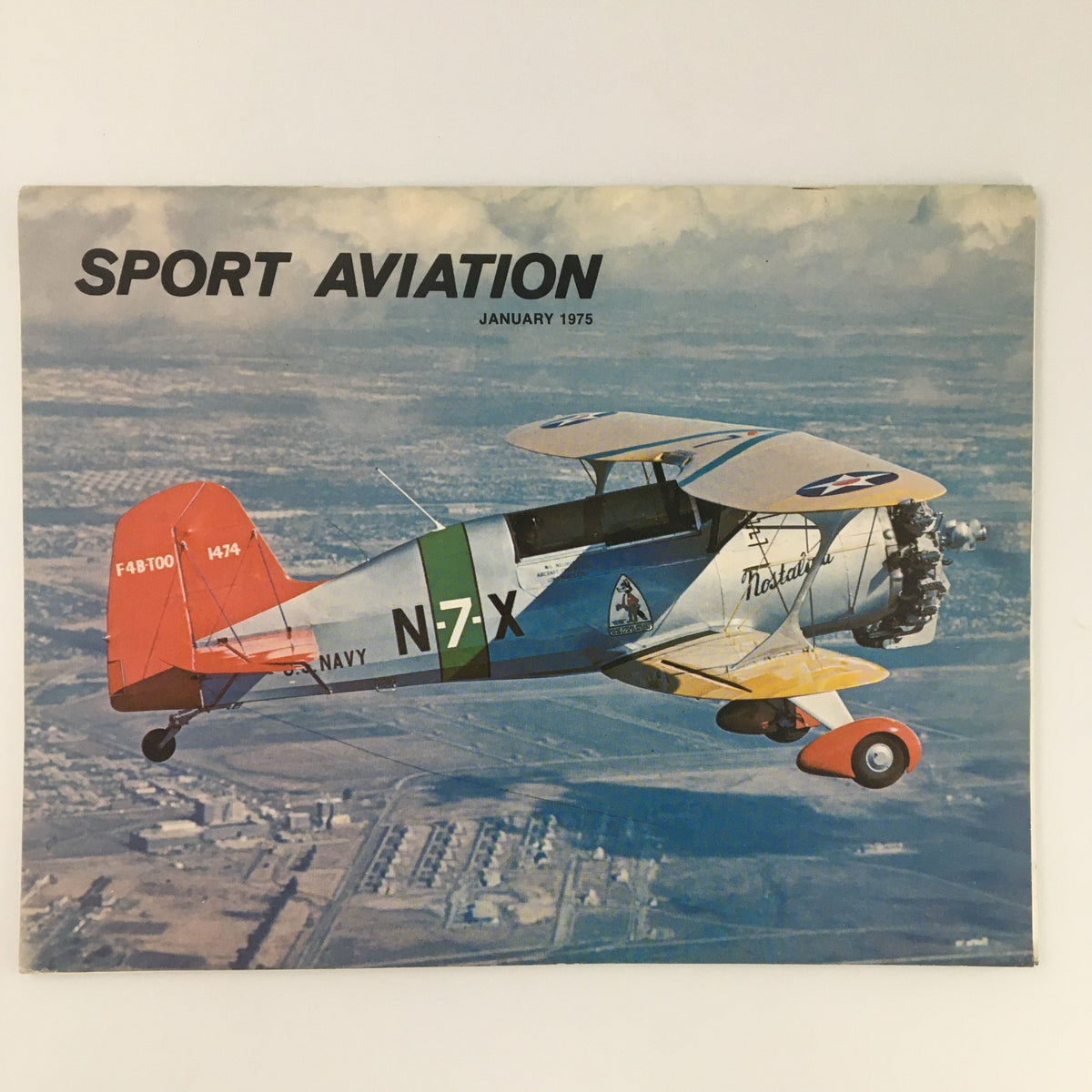 Sport Aviation Magazine January 1975 featuring the HA-2 Sportster Helicopter on the cover, showcasing vintage aviation with a colorful aircraft flying against a scenic backdrop.