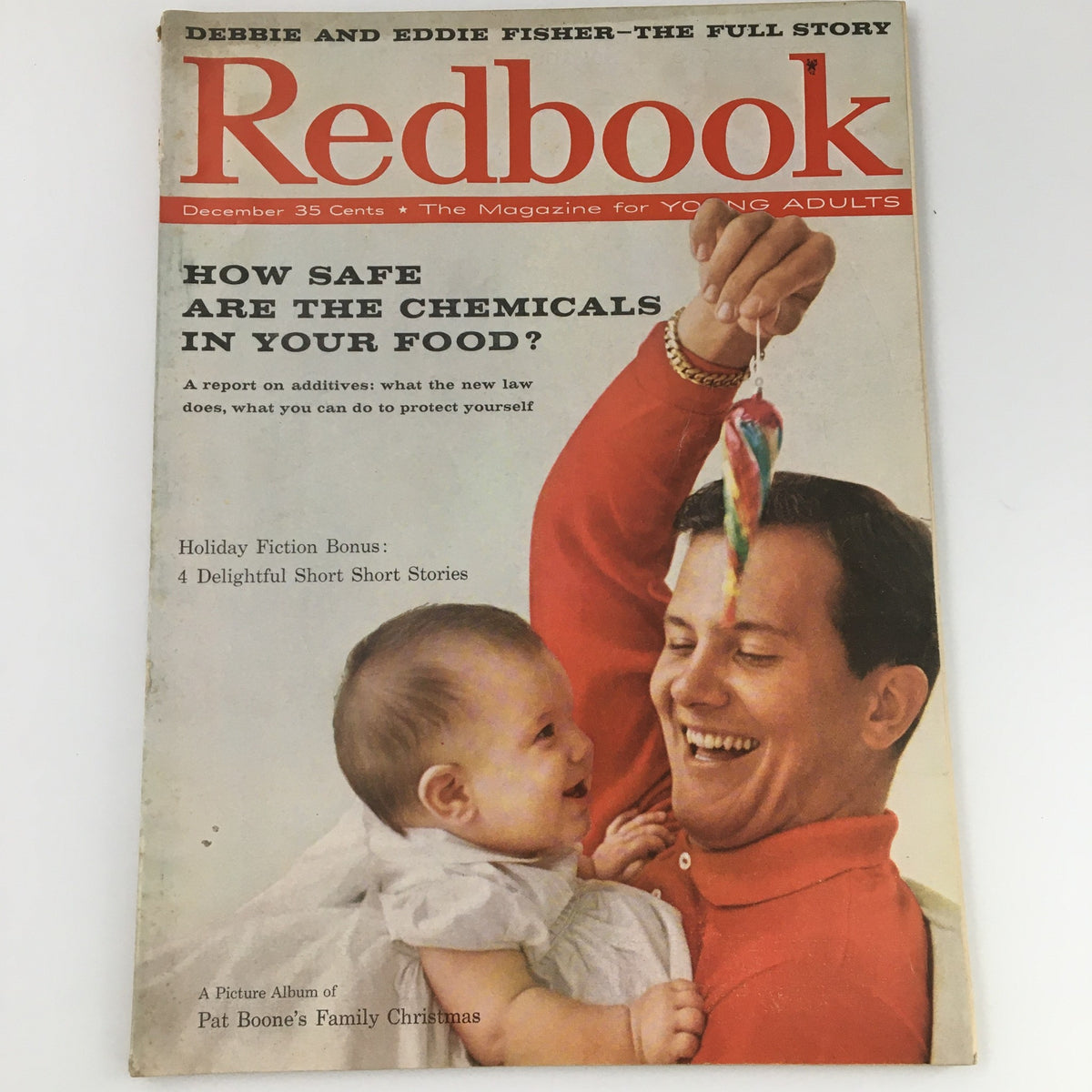 Vintage Redbook Magazine December 1958 cover featuring Pat Boone's family, showcasing a joyful father and baby with festive decoration, a nostalgic piece collectible.