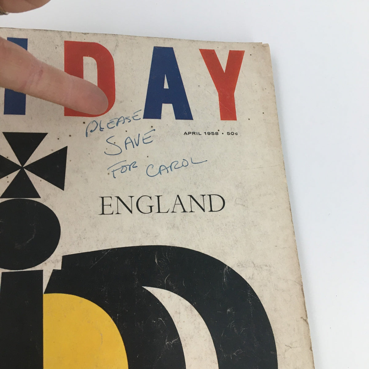 Close-up of VTG Holiday Magazine April 1958 showing handwritten note 'please save for Carol' alongside the striking crown cover design. Ideal for nostalgia and vintage enthusiasts.