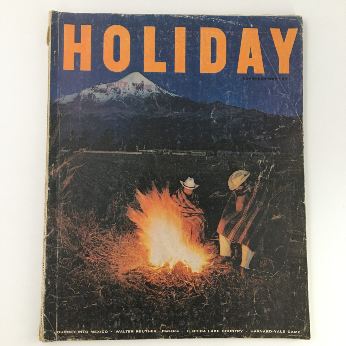 VTG Holiday Magazine November 1959 cover featuring a scenic night landscape with a bonfire and two figures in traditional attire, highlighting Walter Reuther Part One feature.