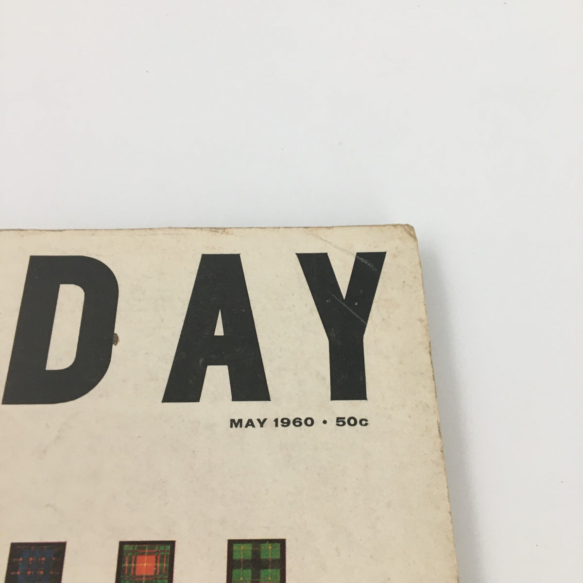 Detail of the title 'DAY' on the cover of VTG Holiday Magazine May 1960, along with the publication date and price.
