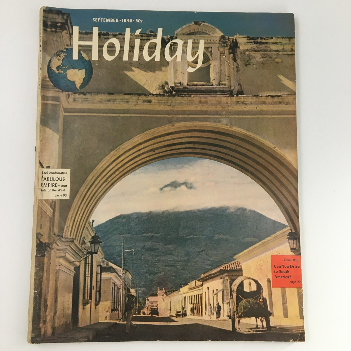 Cover of the VTG Holiday Magazine September 1946 featuring an Empire theme, showcasing a picturesque archway with a scenic backdrop. The magazine is identified as the newsstand edition.
