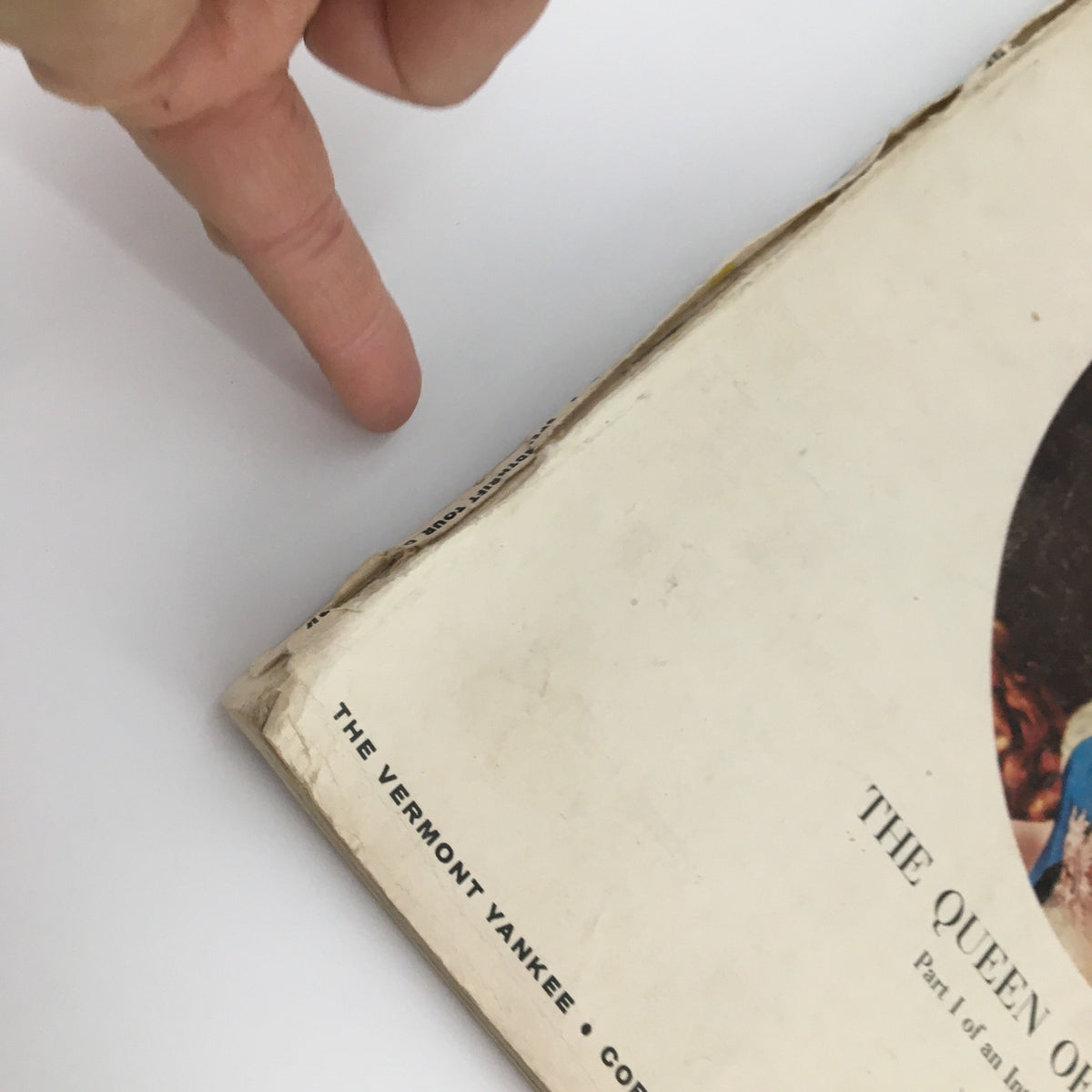 Detailed view of another edge of the VTG Holiday Magazine November 1957 Queen Elizabeth Cover, highlighting wear characteristic of vintage magazines.