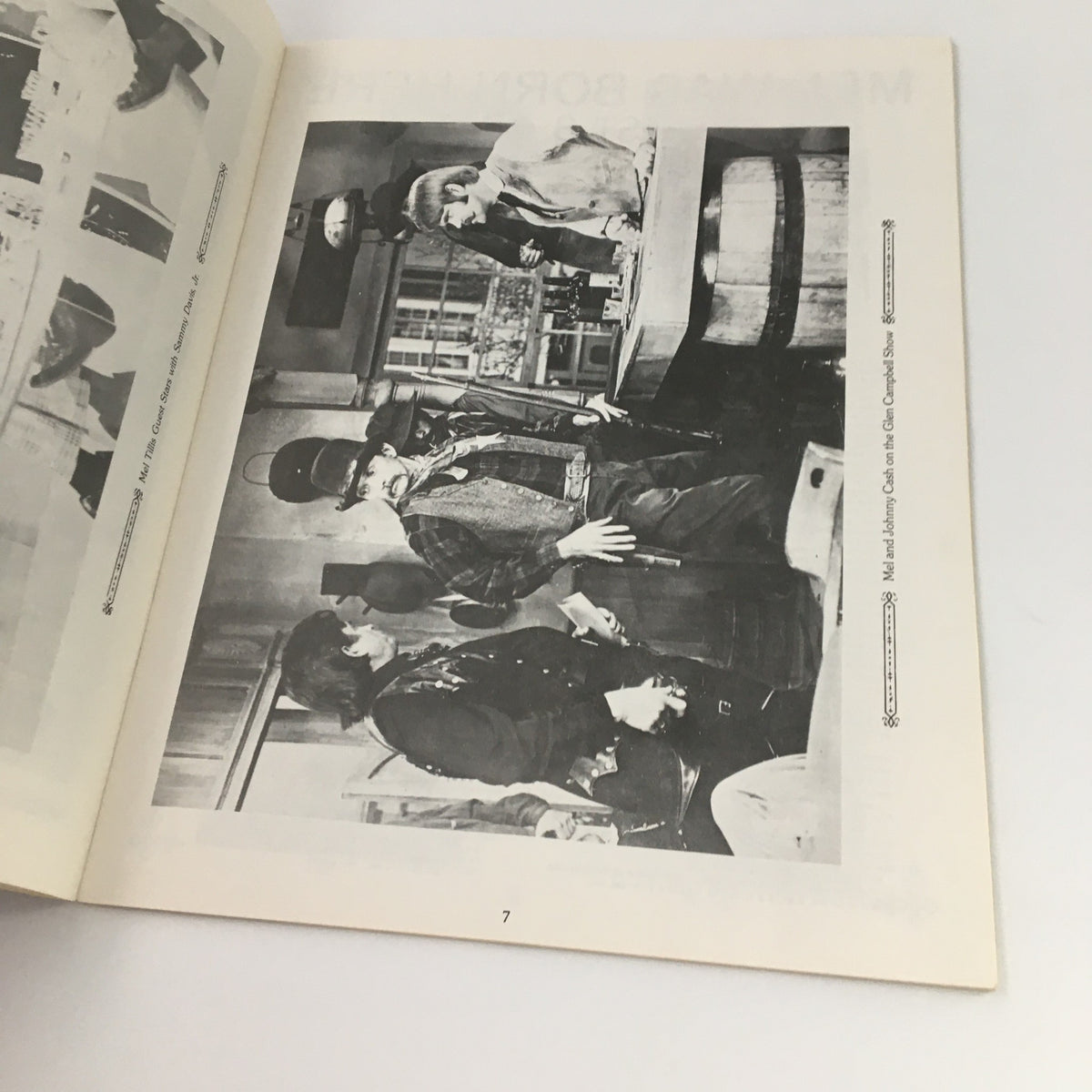 Inside page of the VTG 1976 Mel Tillis Souvenir Program featuring Mel Tillis in a black and white photograph with a scene depicting a performance alongside colorful imagery.