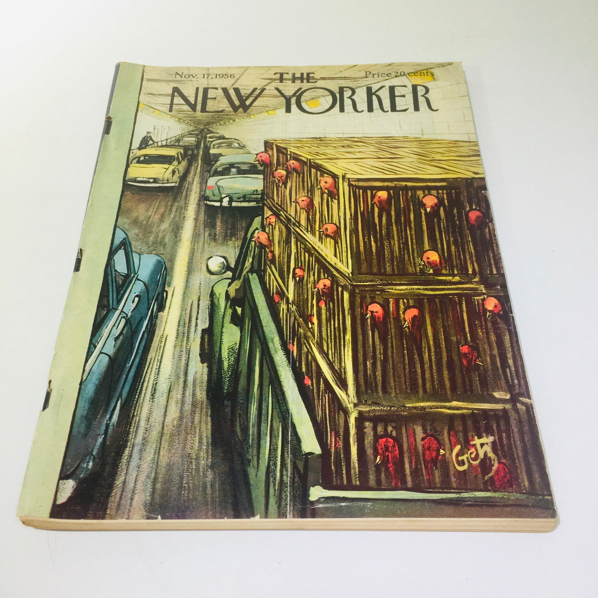 The New Yorker Magazine cover from November 17, 1956, illustrated by Arthur Getz, showcasing a busy street scene with cars and crates, highlighting themes of urban life.