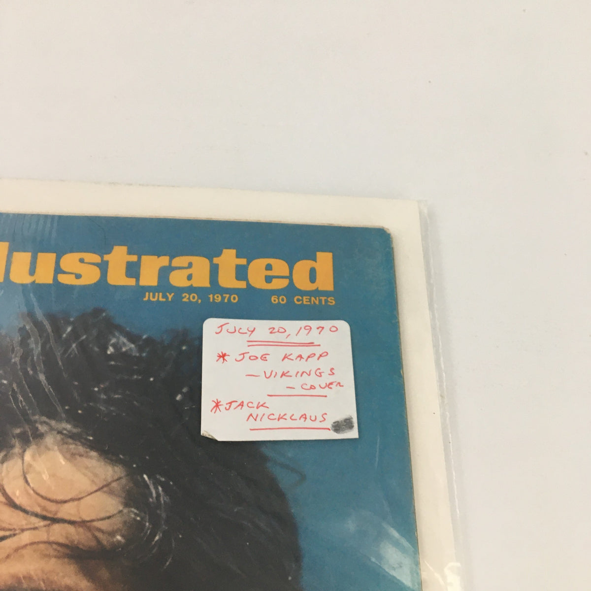 Detailed view of the Sports Illustrated magazine cover with a sticker noting Joe Kapp and Jack Nicklaus, dated July 20, 1970.