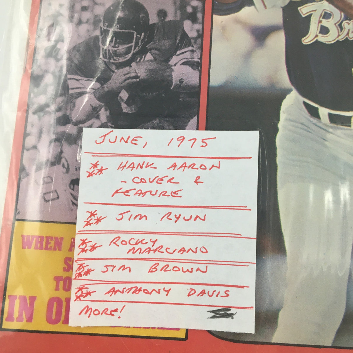 Close-up of a note on the VTG Sports Review Magazine June 1975, detailing Hank Aaron as the cover feature and other notable sports figures.