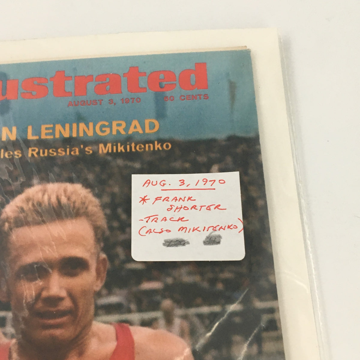 Detail of Sports Illustrated August 3, 1970 cover, highlighting the date and description of Frank Shorter and runner Mikitenko's race results.
