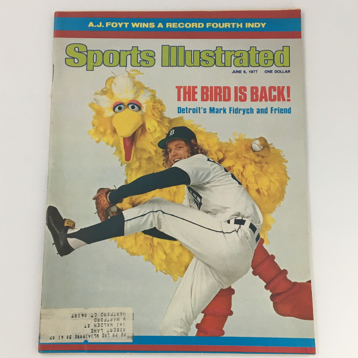 Vintage Sports Illustrated Magazine June 6, 1977 featuring MLB Pitcher Mark Fidrych on the cover with a large yellow bird, symbolizing Fidrych's unique personality and impact on baseball.