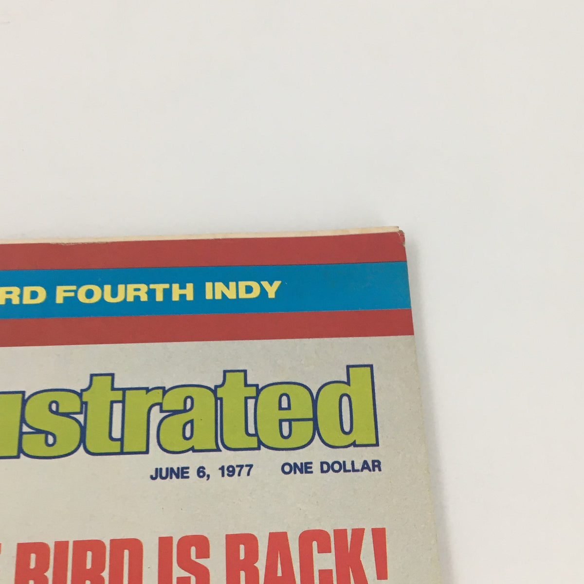 Close-up of Sports Illustrated Magazine dated June 6, 1977 featuring Mark Fidrych, highlighting the magazine's title and date along with the iconic phrase 'THE BIRD IS BACK!'.