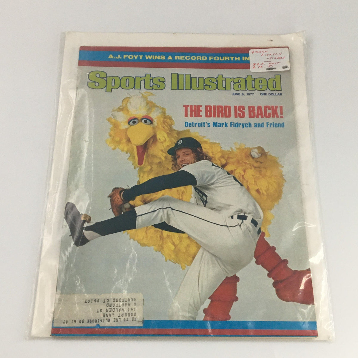 Sports Illustrated Magazine June 6, 1977 featuring Detroit's Mark Fidrych with a yellow bird, encased in protective plastic for preservation, showcasing its collectible nature.