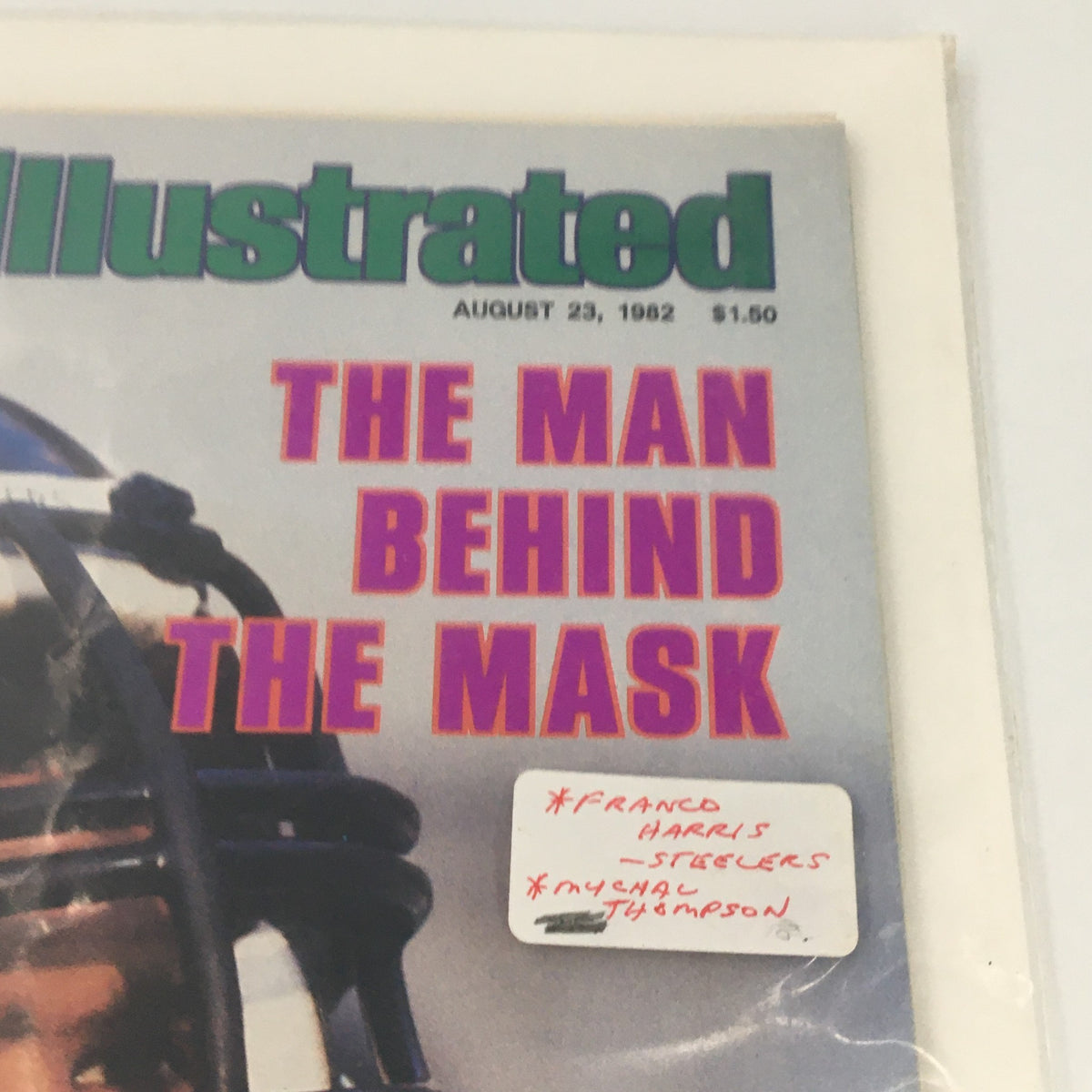 Close-up of the Vintage Sports Illustrated Magazine August 23, 1982 cover, showcasing Franco Harris of Pittsburgh, emphasizing the article 'The Man Behind the Mask'.