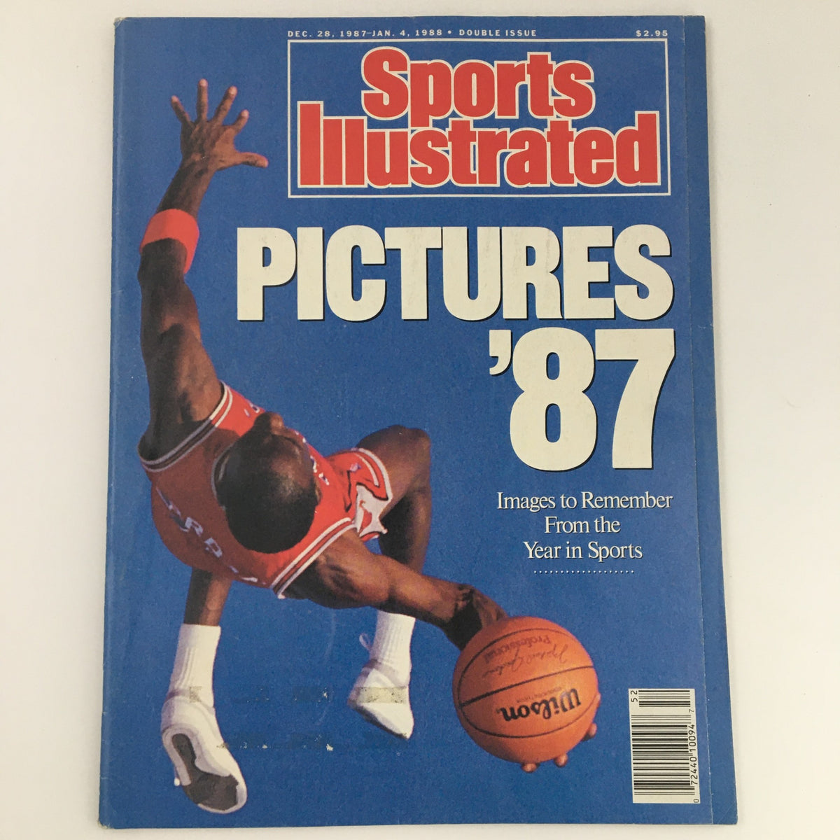Cover of Sports Illustrated Magazine from December 28, 1987 to January 4, 1988, featuring a dynamic image of a basketball player with the headline 'PICTURES '87' highlighting significant moments in sports.