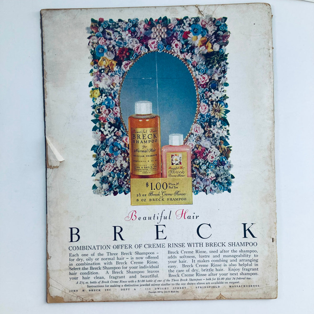 Back cover of TV Radio Mirror Magazine September 1957, featuring an advertisement for Breck Shampoo, capturing vintage advertising aesthetics.
