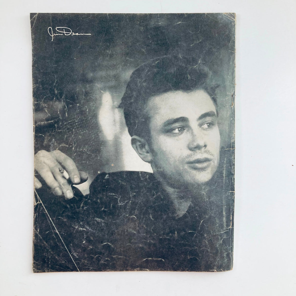 VTG 1956 James Dean Official Anniversary Book cover image displaying a portrait of James Dean, highlighting his iconic look and charisma.