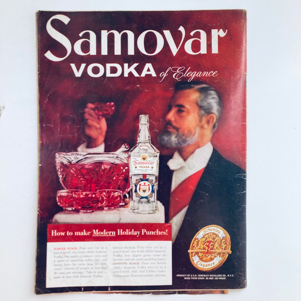Vintage advertisement for Samovar Vodka from the era of VTG Playboy Magazine December 1957, showcasing holiday punch recipes.