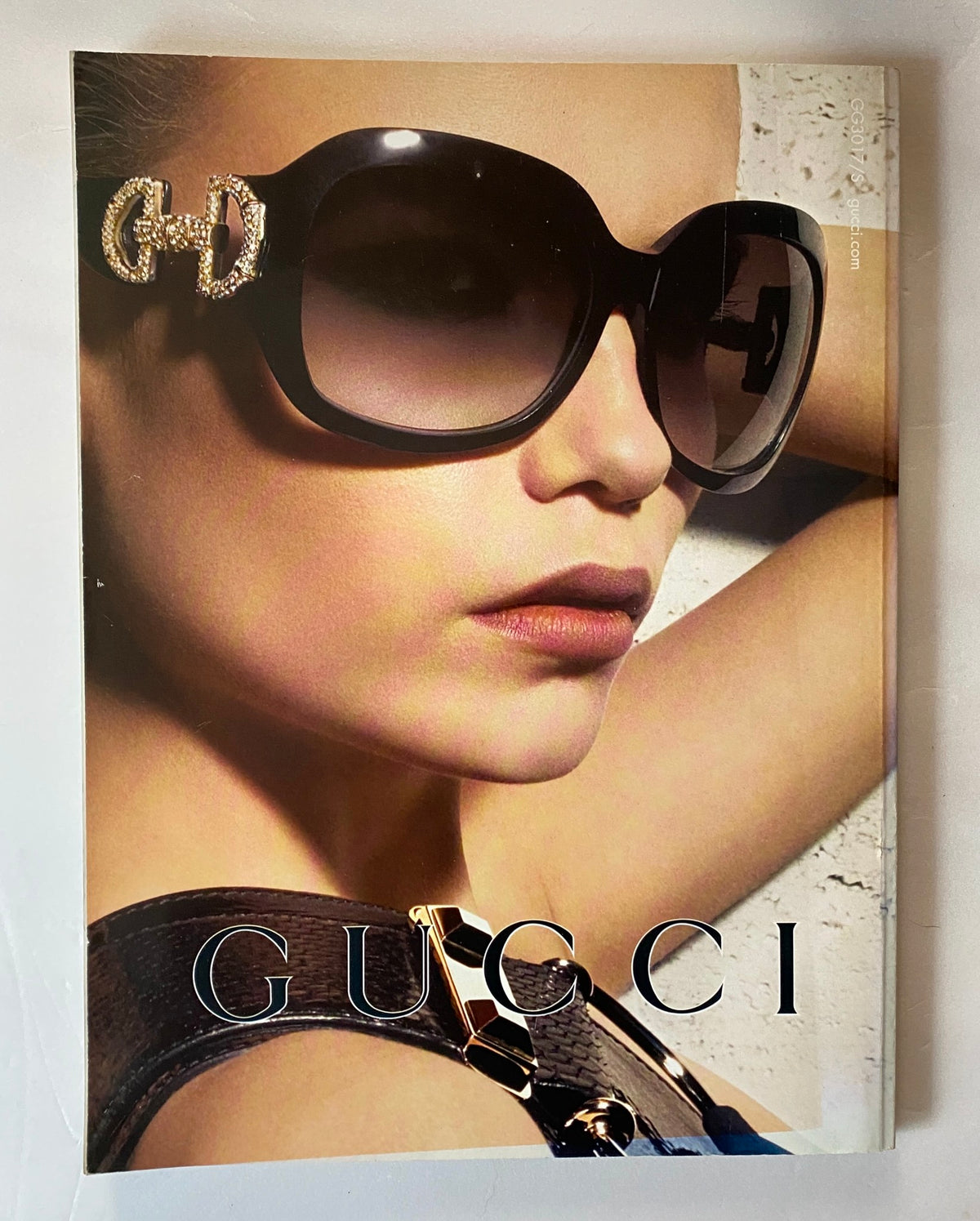 Cover of the Harper's Bazaar UK Magazine May 2008 showcasing a model wearing large Gucci sunglasses, emphasizing luxury fashion and style.