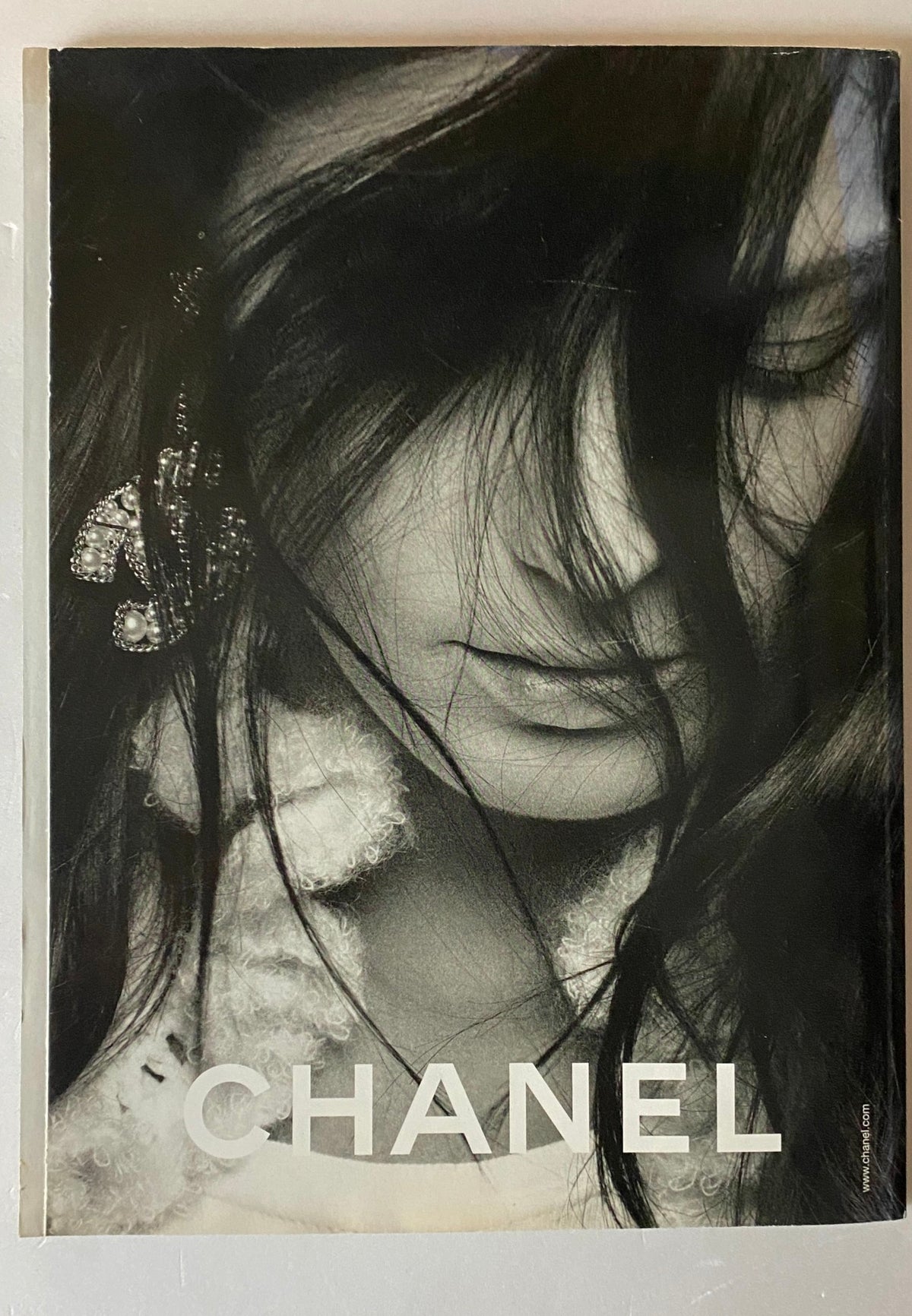 Back cover of Harper's Bazaar British Edition Magazine August 2006 featuring a striking black and white image for Chanel, enhancing the magazine's fashion narrative.