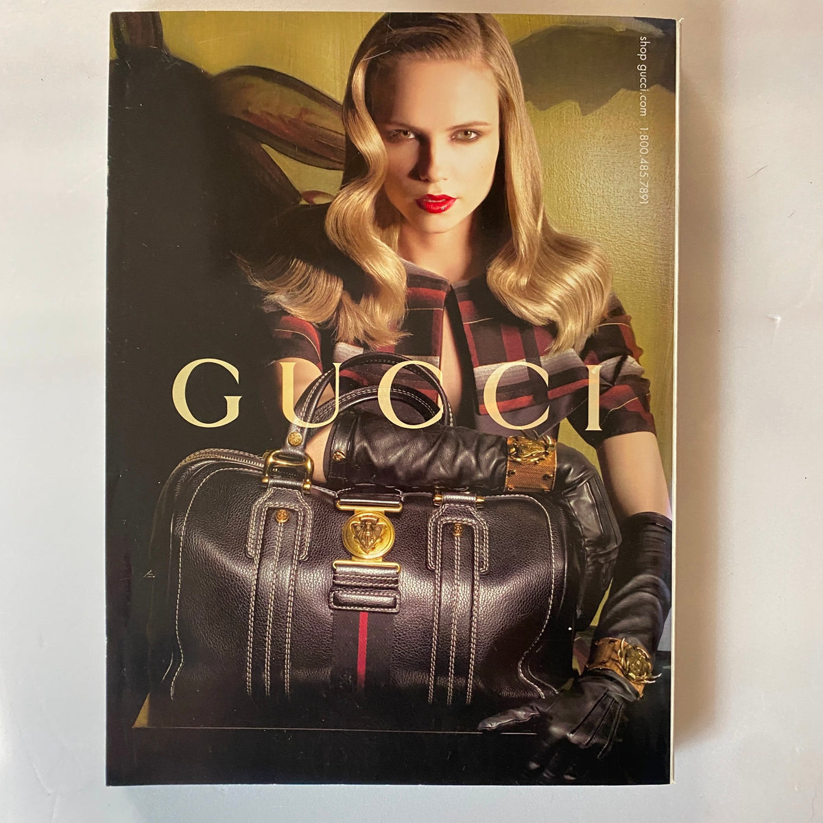 Back cover of a Gucci magazine, showcasing luxury fashion items, in alignment with the fashion themes presented in Vanity Fair Magazine September 2007.