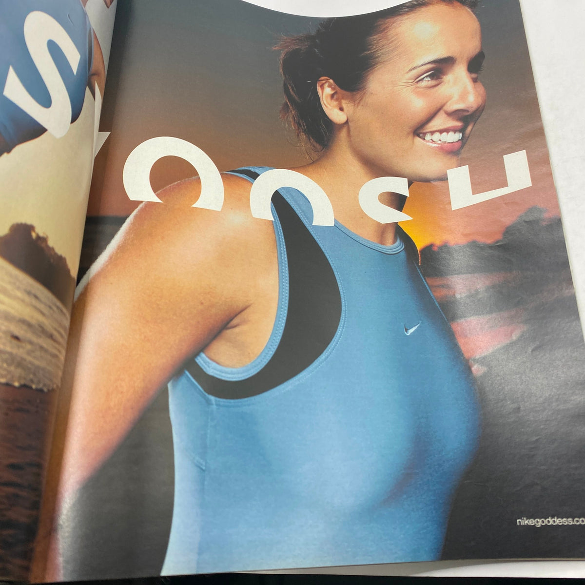 The New York Times Magazine Spring 2002 Part 2 showcasing an athletic advertisement with a smiling model in a blue Nike tank top against a sunset backdrop.
