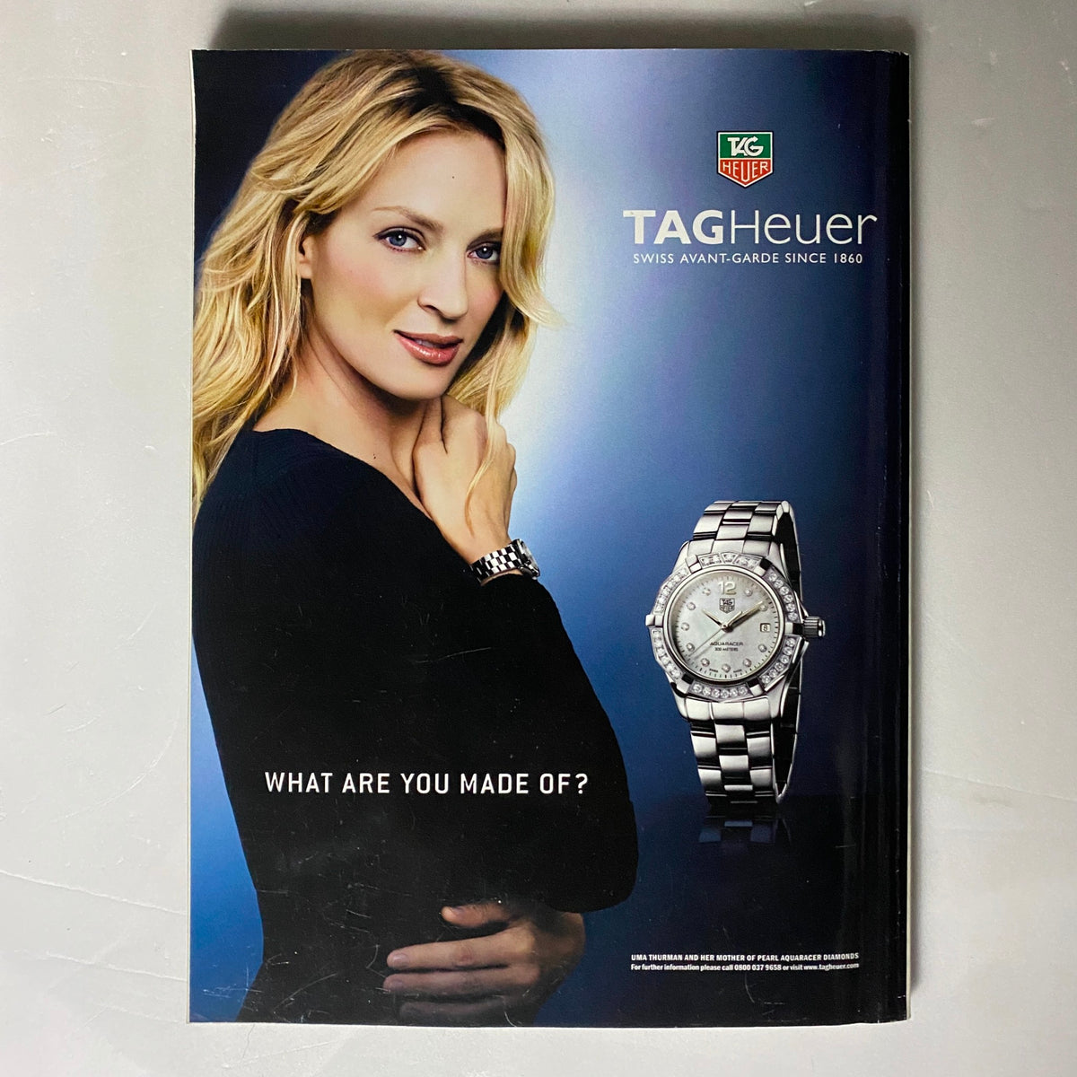 Advert for TAG Heuer jewelry in Harper's Bazaar UK Magazine July 2008 featuring a stylish woman wearing a watch, promoting luxury and elegance.