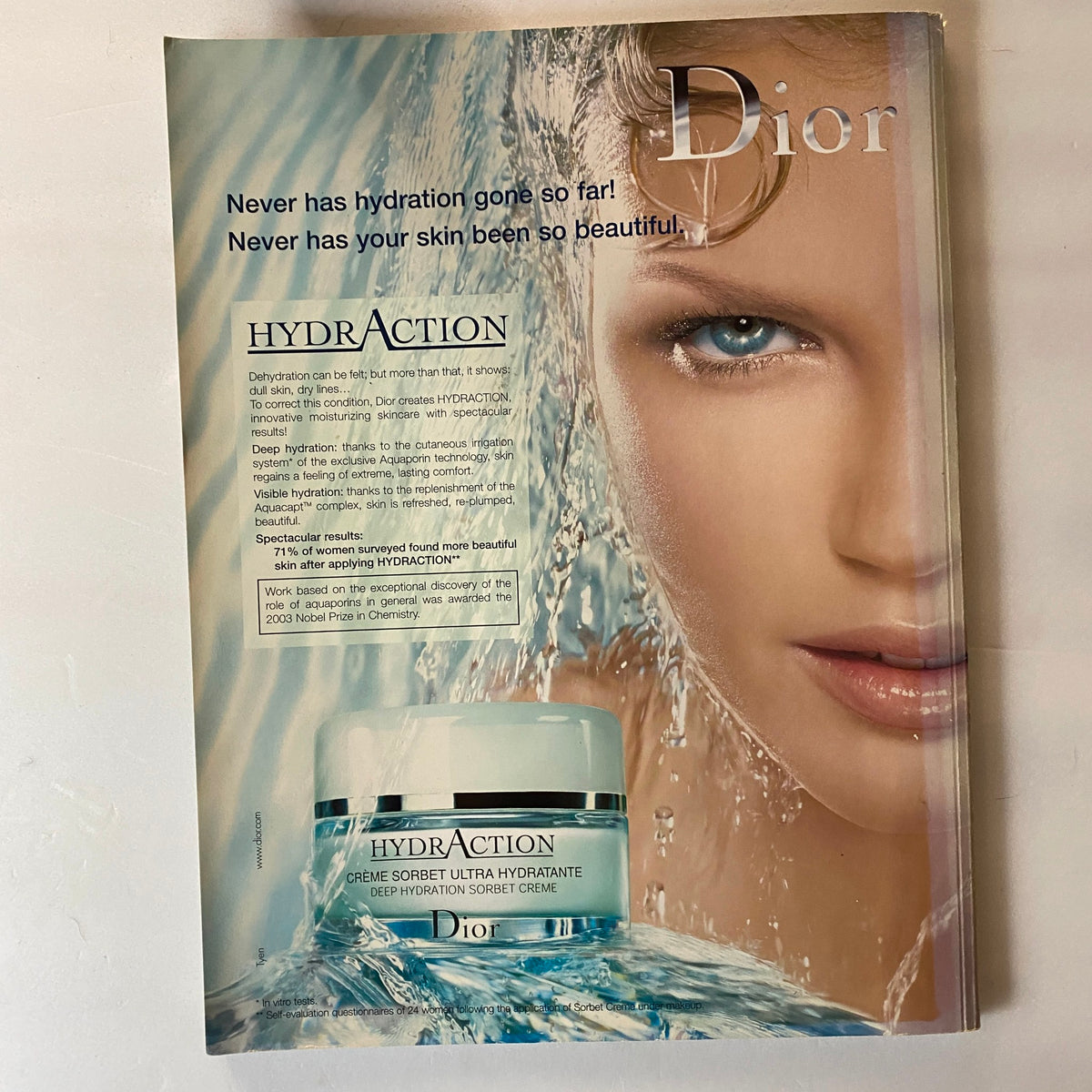Dior advertisement featuring a model with sleek hair, promoting HYDRAction skincare line, alongside the text 'Never has hydration gone so far! Never has your skin been so beautiful!' This image accompanied the August 2006 issue of Harper's Bazaar Australia Magazine, featuring Mary-Kate Olsen on the cover.