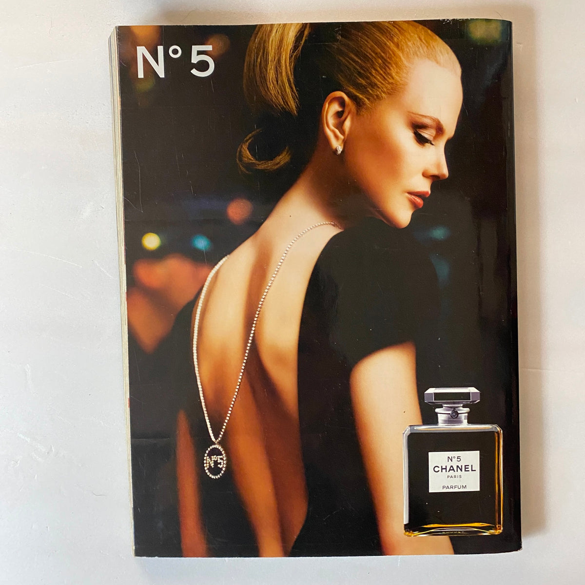 Advertisement for Chanel N°5 perfume featuring a model in elegant fashion, from Harpers & Queen UK Magazine November 2005, exemplifying high-end beauty.