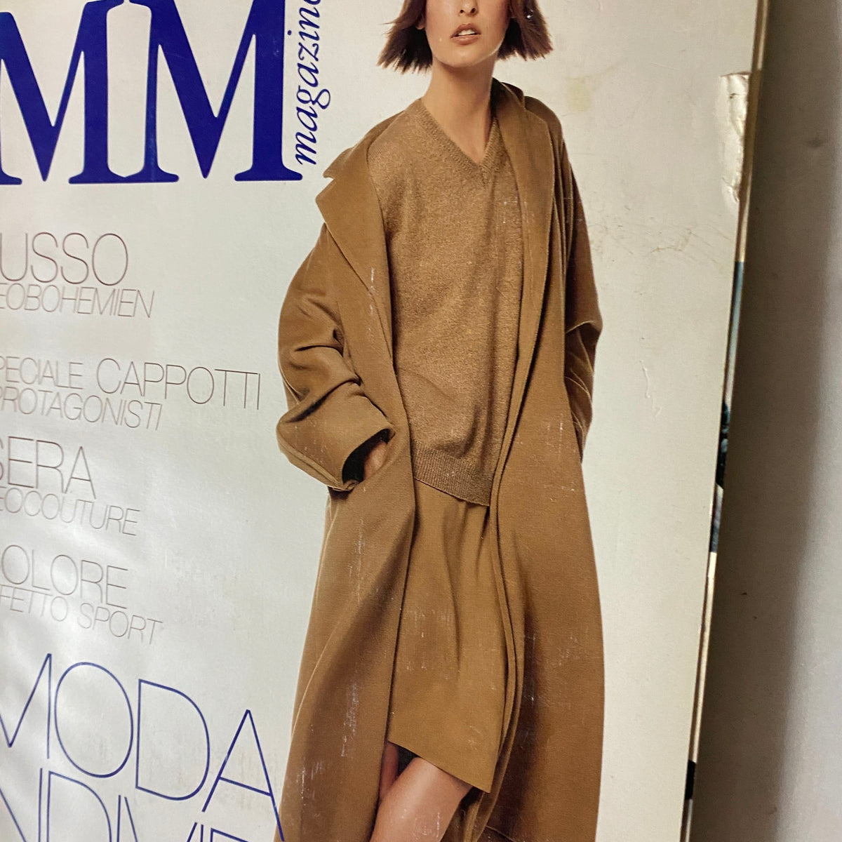 Cover of Max Mara Magazine 1997 featuring a model in a chic brown outfit, showcasing 90s fashion trends.