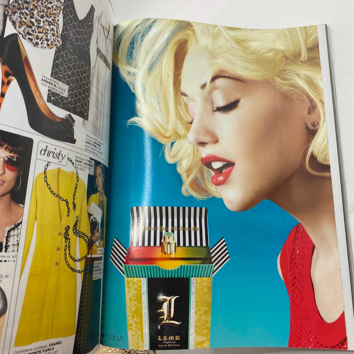 Fashion advertisement page from Elle Magazine October 2007 featuring a glamorous model with blonde hair and a striking red outfit, showcasing a colorful perfume box from L.A.M.A.R. This page highlights the latest trends in beauty and lifestyle for the Personal Style Issue.