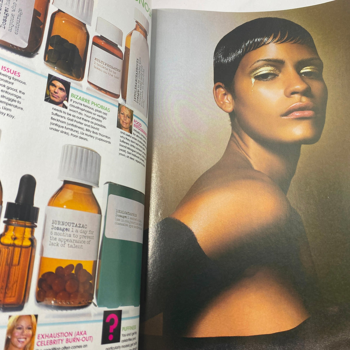 Another inside page from Elle UK Magazine May 2003, displaying striking beauty and fashion elements, presenting a model with a contemporary look and style.