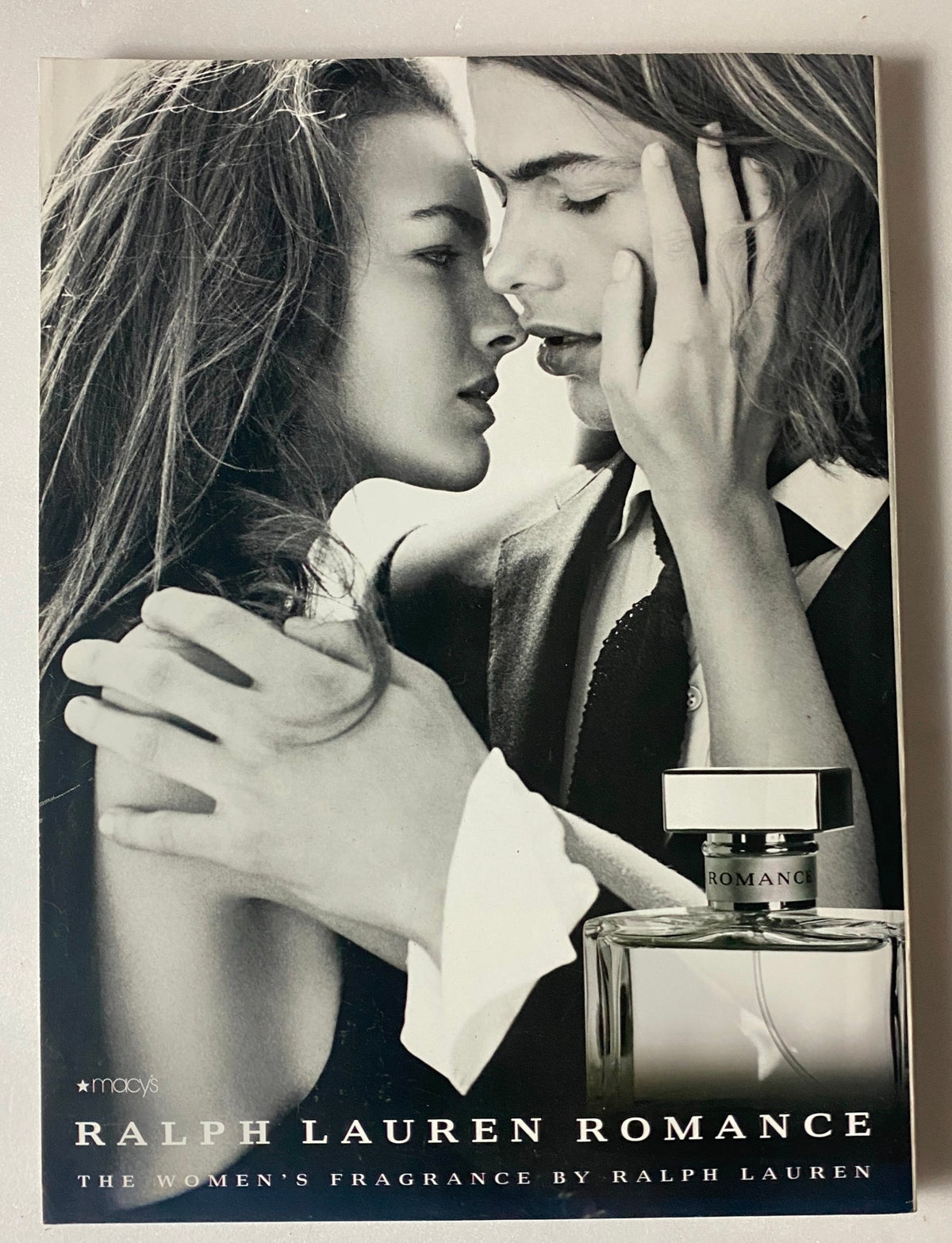 Ralph Lauren Romance fragrance advertisement featured in the Marie Claire September 2006, showcasing a romantic black and white image.